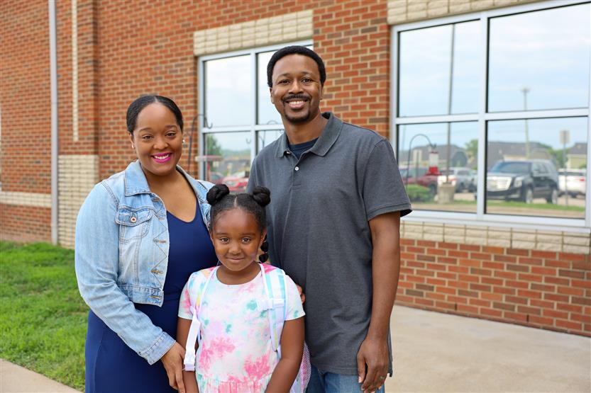 A family smiles